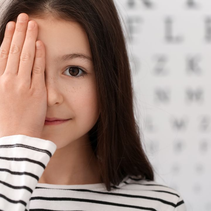 Young girl having eye exam